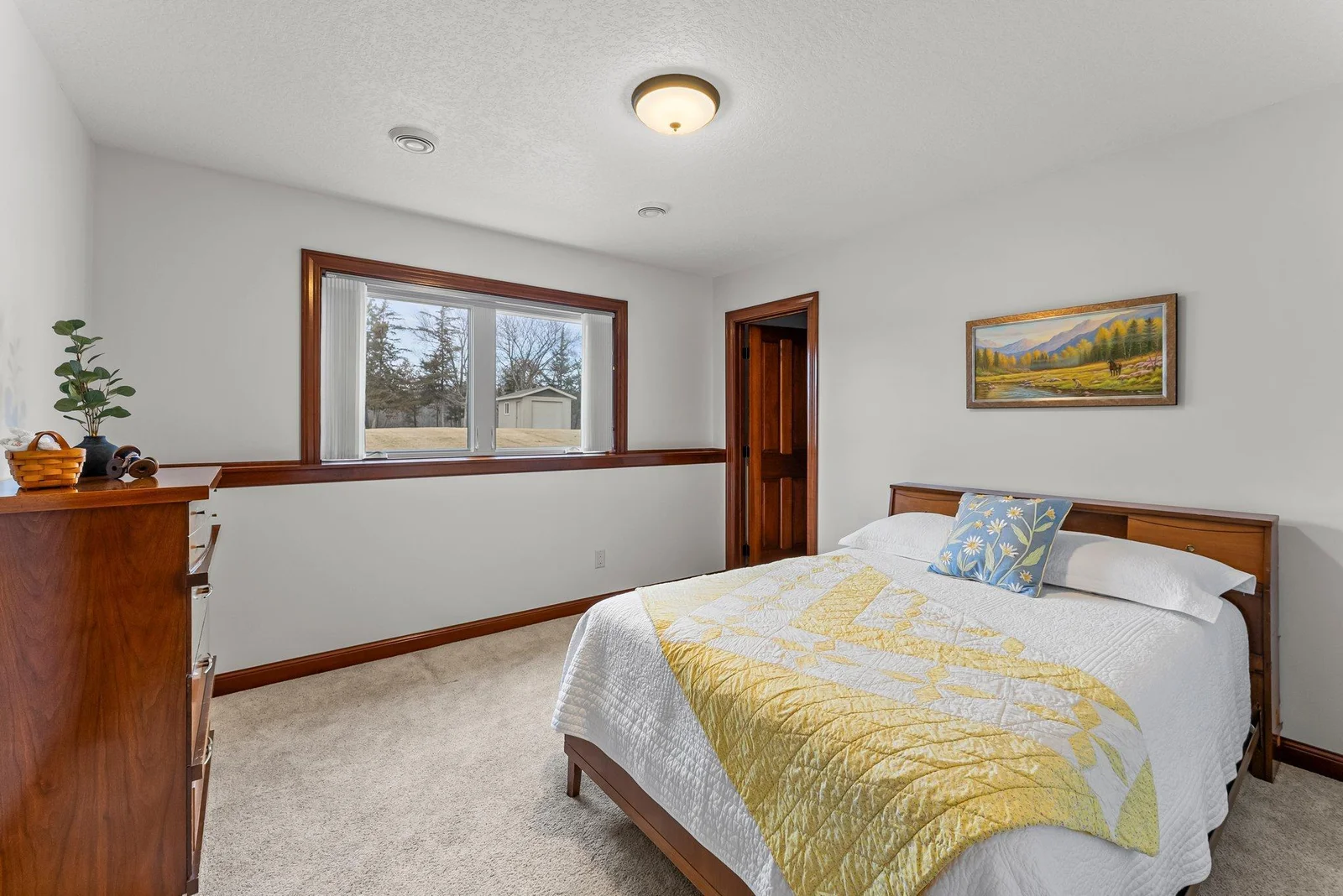 Two additional spacious bedrooms are located downstairs.