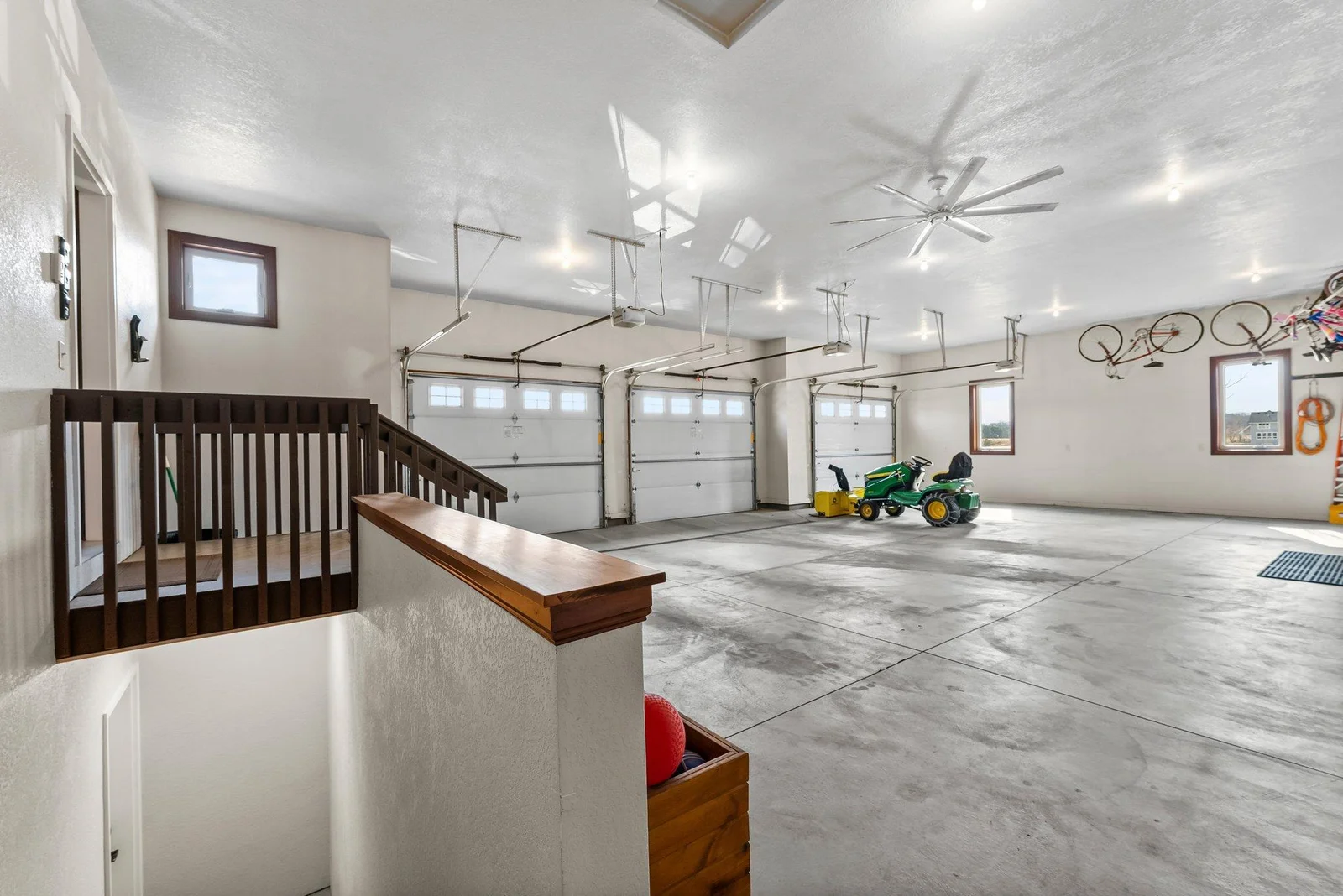 The finished, insulated, and heated 4-car garage is the ultimate in convenience and functionality, featuring a floor drain, 220-amp service, and a water spigot for added utility.