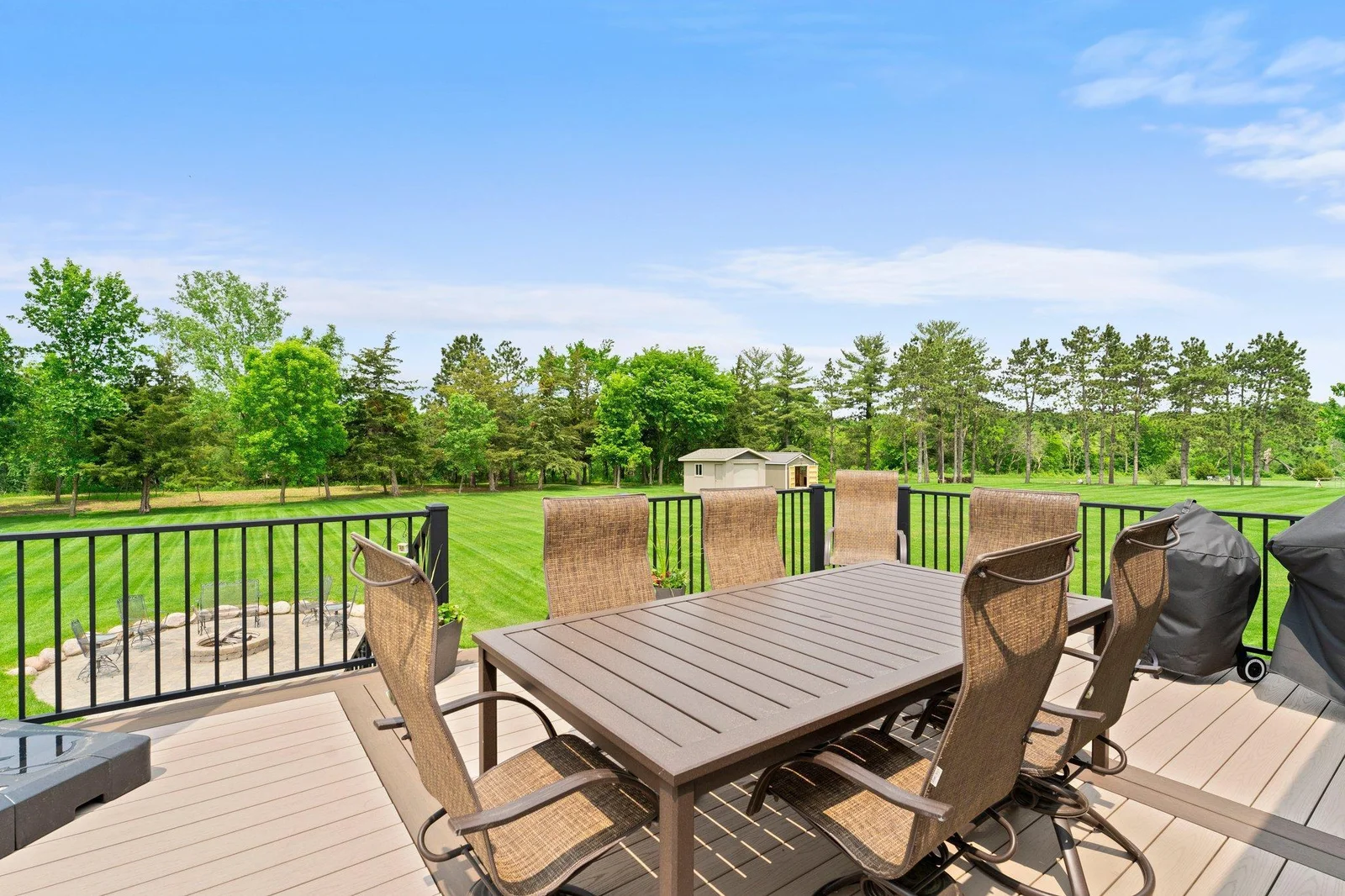 A gas line to the grill adds convenience for outdoor entertaining, making this space ideal for gatherings.