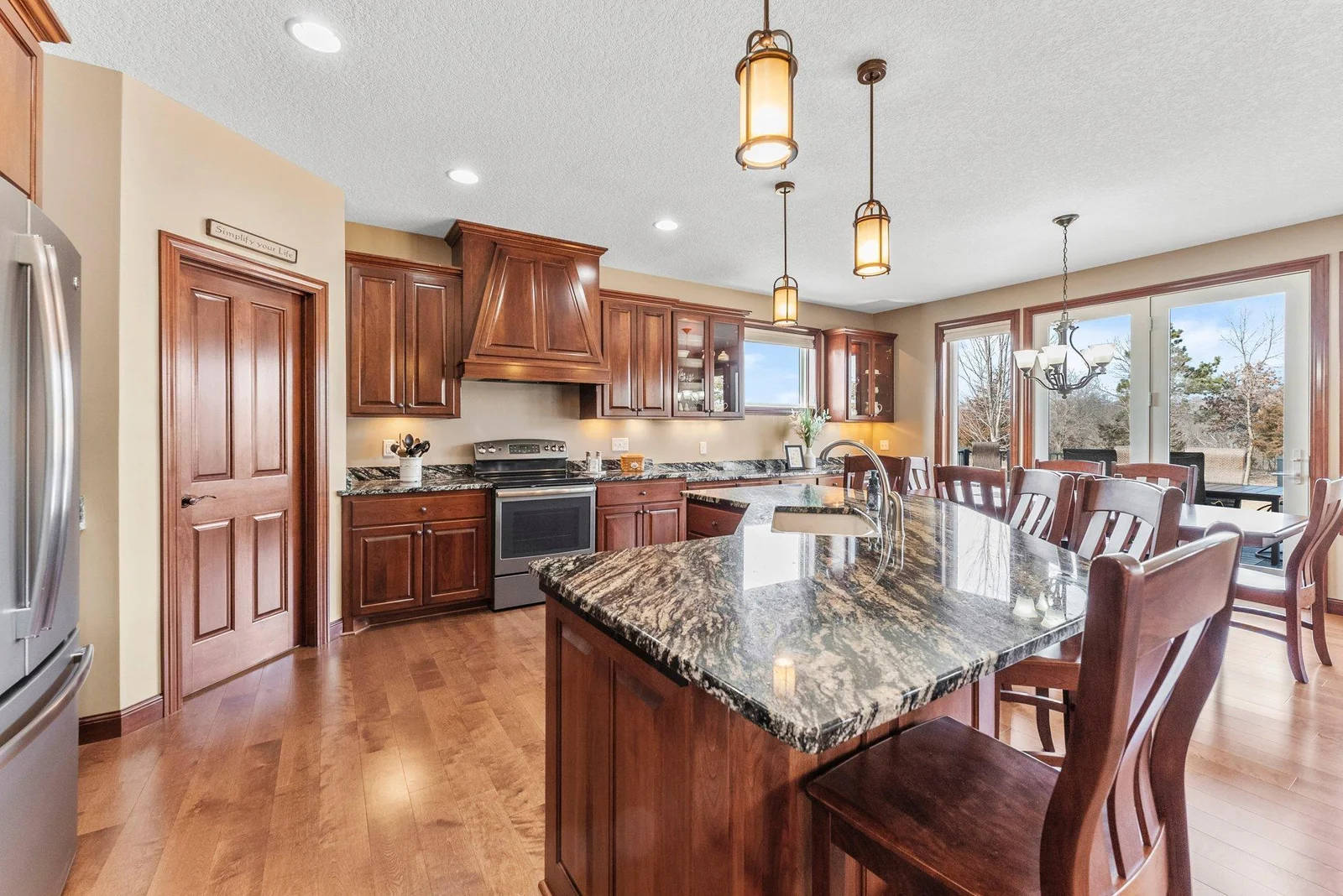 The adjacent buffet area offers additional cabinetry and counter space. Whether you're preparing meals or hosting friends and family, this kitchen is both functional and beautiful.