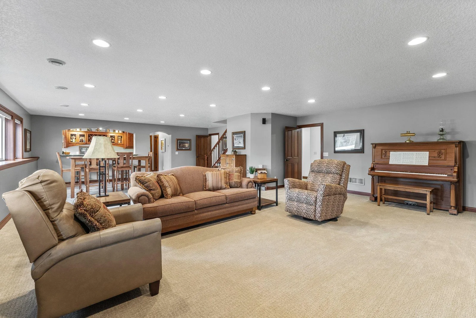 Descending to the lower level, you’ll find a large family room that is perfect for entertaining.