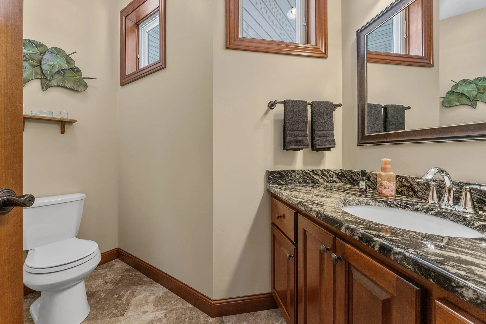 A half bath in the mudroom area is a compact, functional space providing a place to freshen up before entering the main living areas.