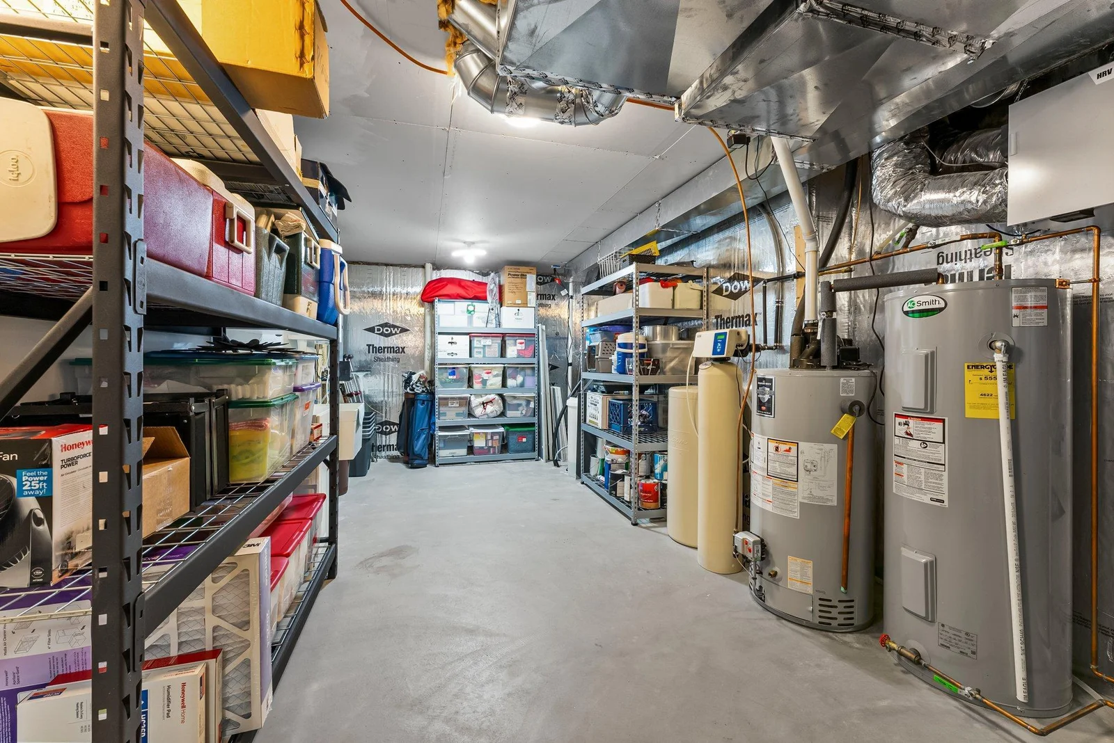 The utility room is a spacious, well-organized area designed for efficiency, featuring ample storage. It houses a state-of-the-art geothermal HVAC system, providing eco-friendly and cost-effective climate control.