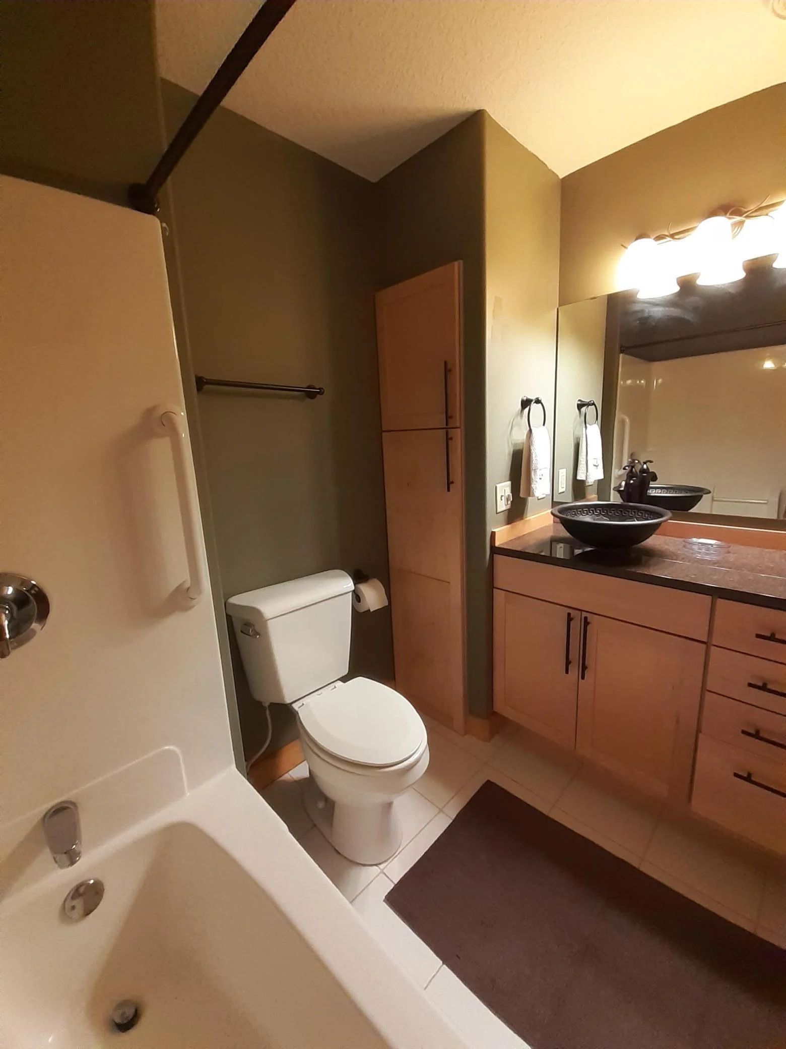 Ensuite bath with maple cabinets & granite counter.jpg