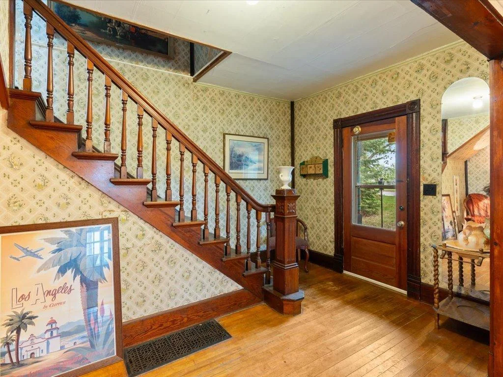 entry and stairwell with beautiful wood accents