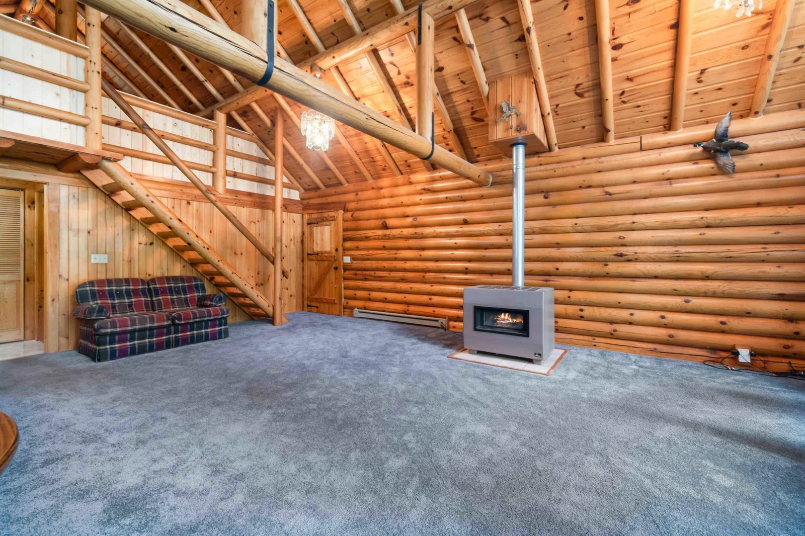 Living room leads to the upper level loft.