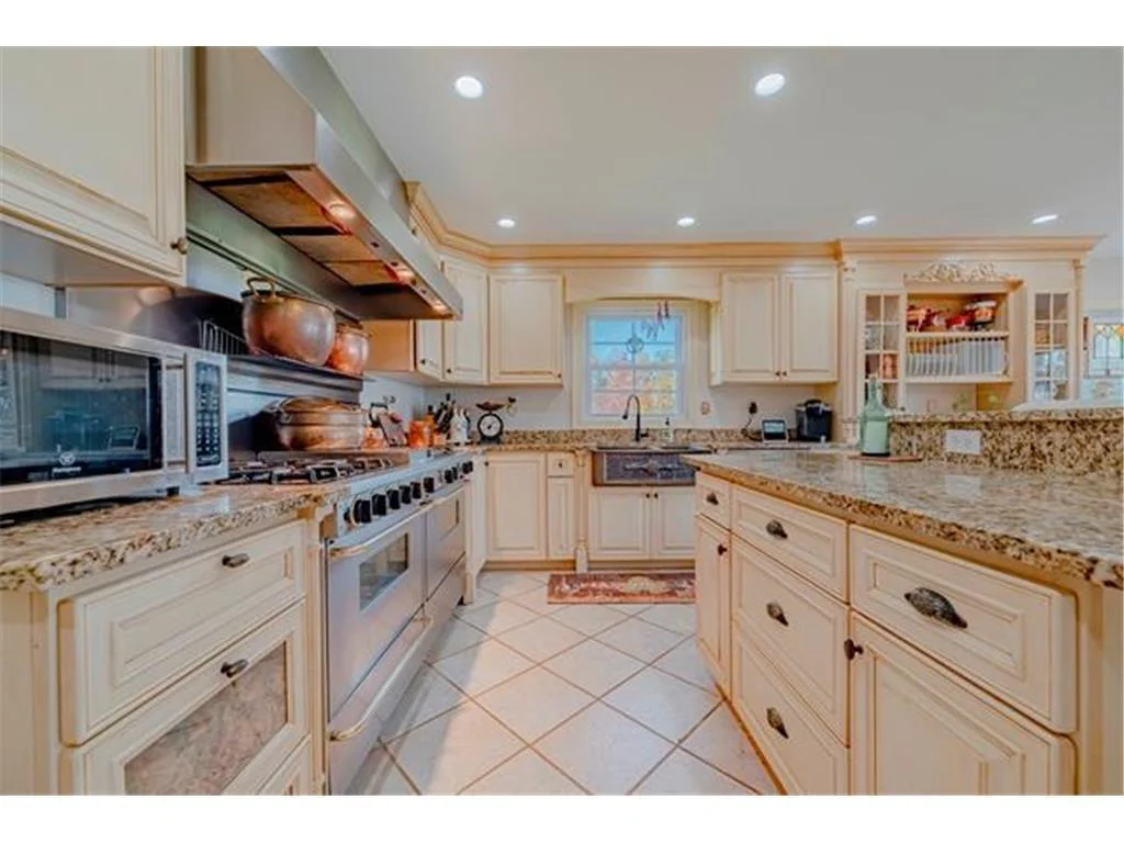 Gourmet kitchen featuring granite countertops.