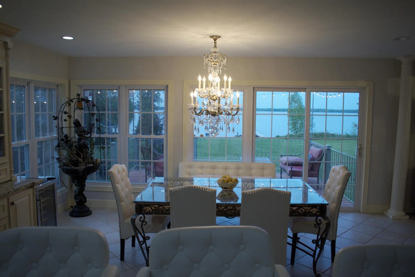 Dining chandelier and view of the lake.