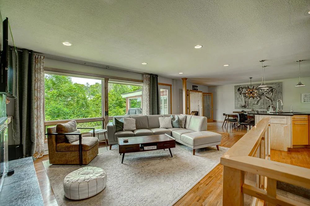The mid-mod vibe is real in the expansive living room.