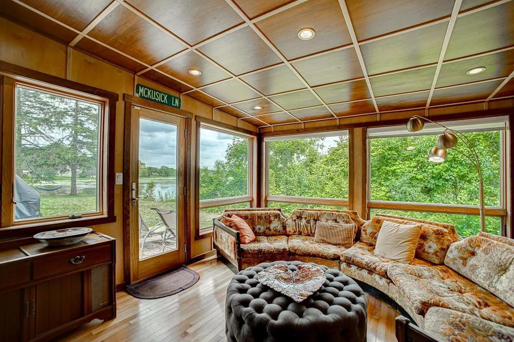 Sunroom with door to the patio