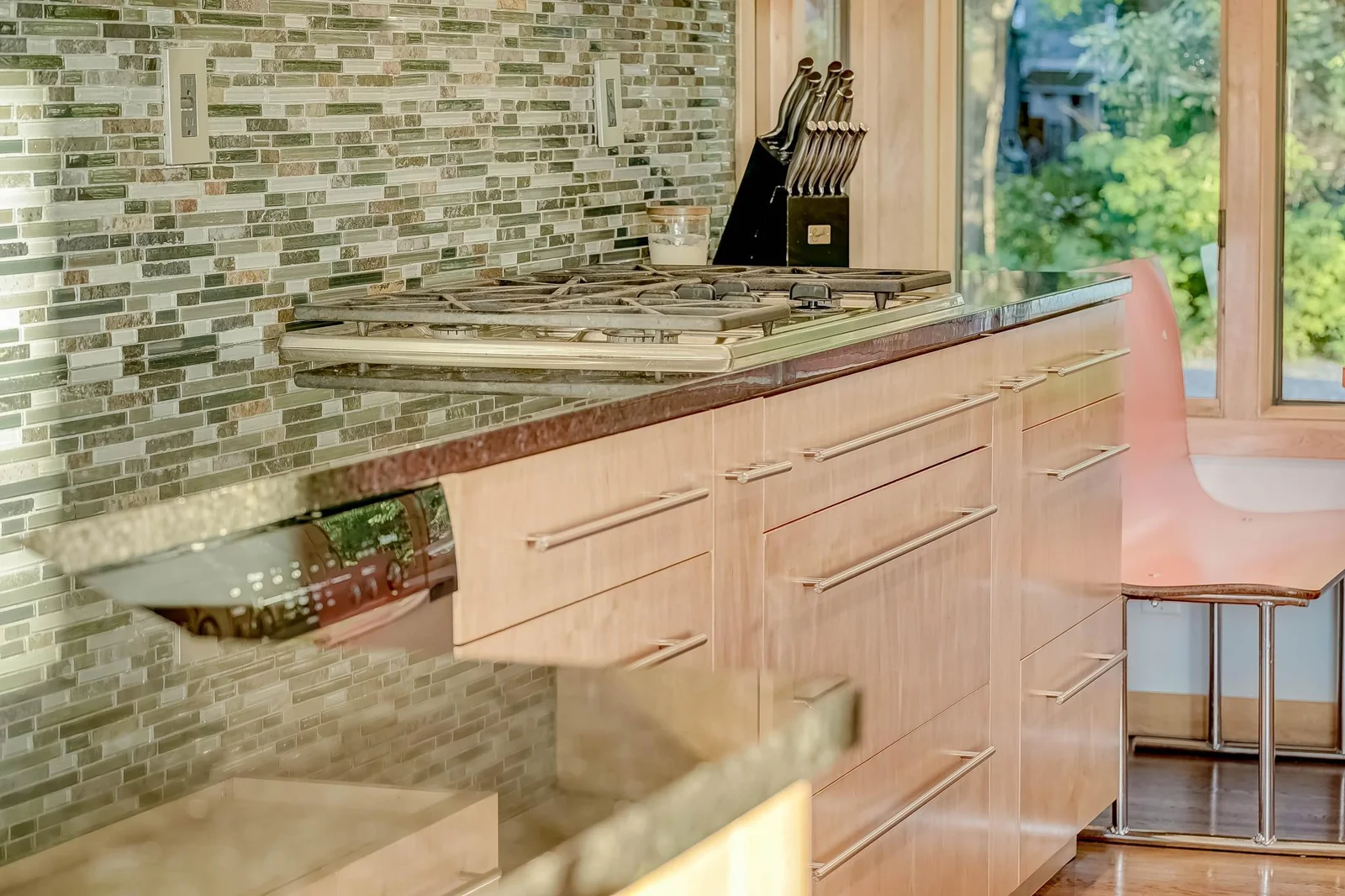 Gleaming stone countertops, 5 burner gas cooktop too!