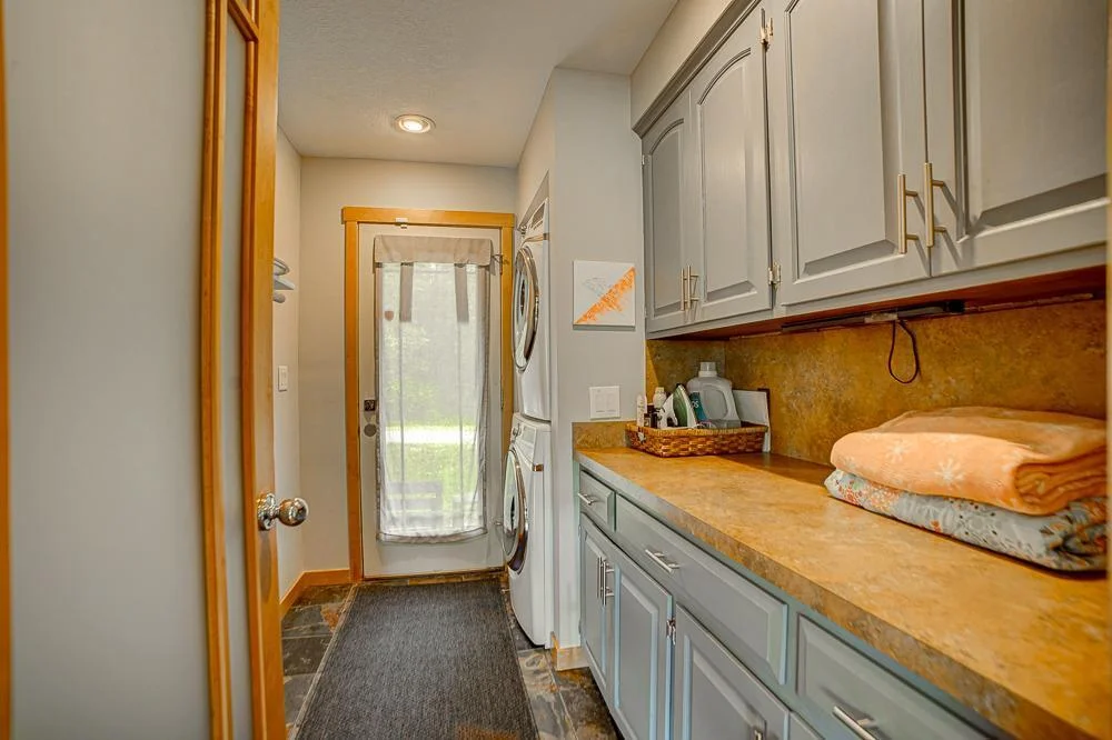 Main-level laundry room with great storage.