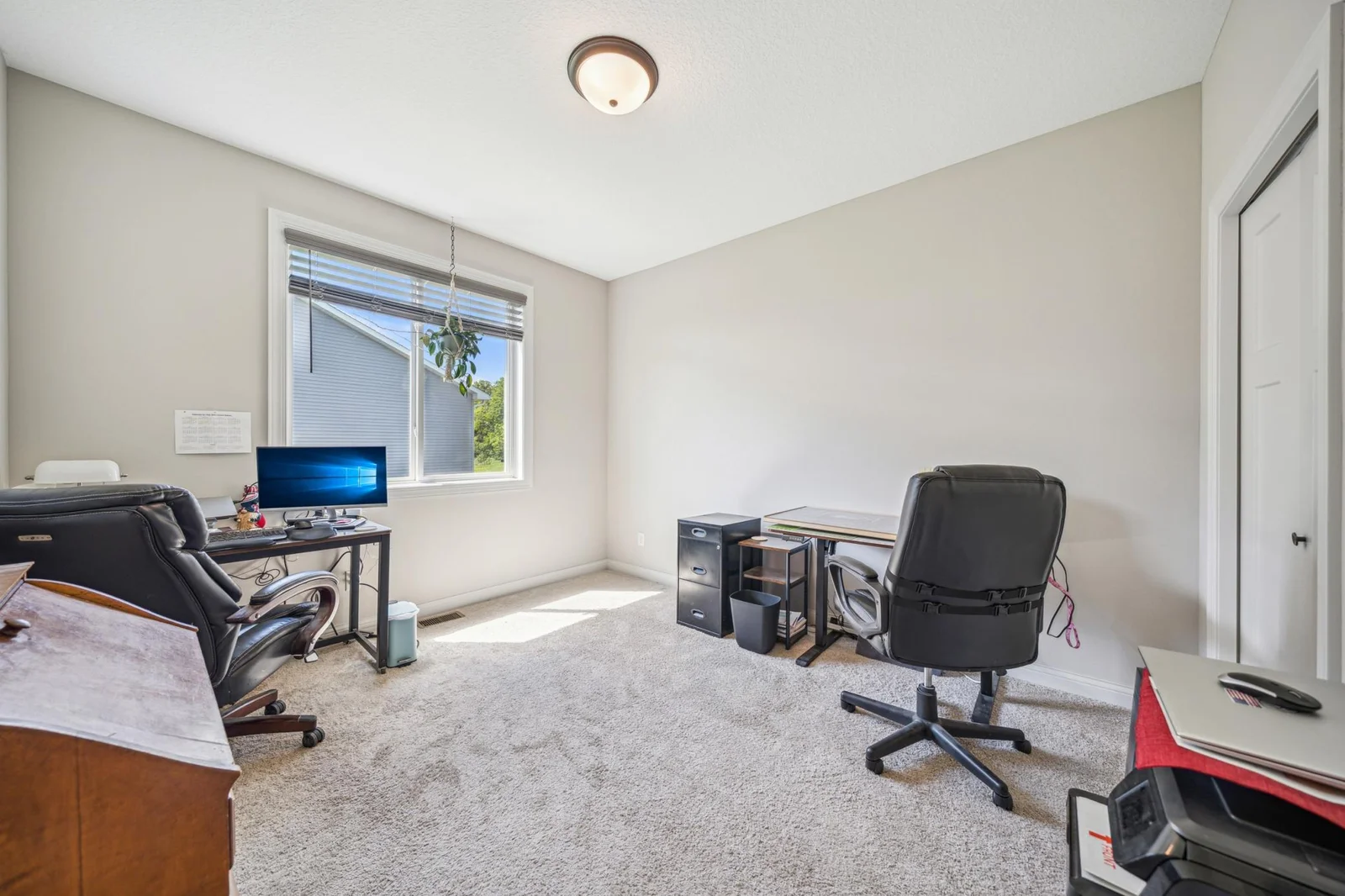 Main level guest bedroom or office with westerly exposure.jpg