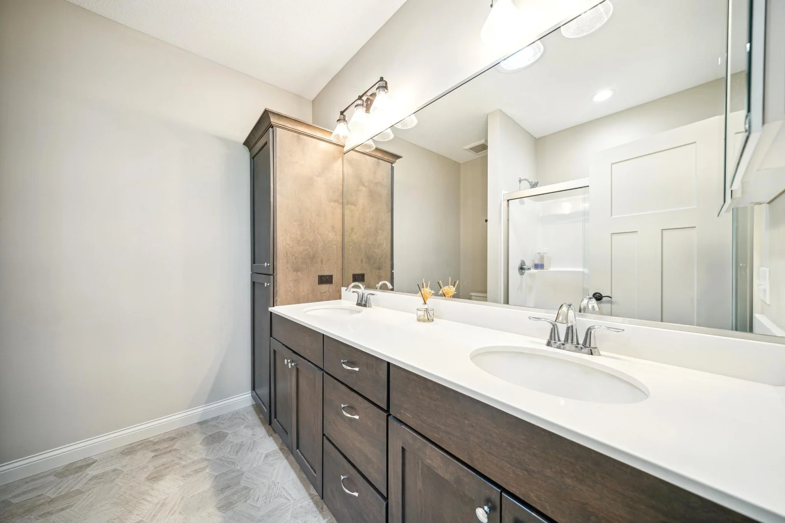 Primary bathroom with dual sink vanity walk in shower.jpg