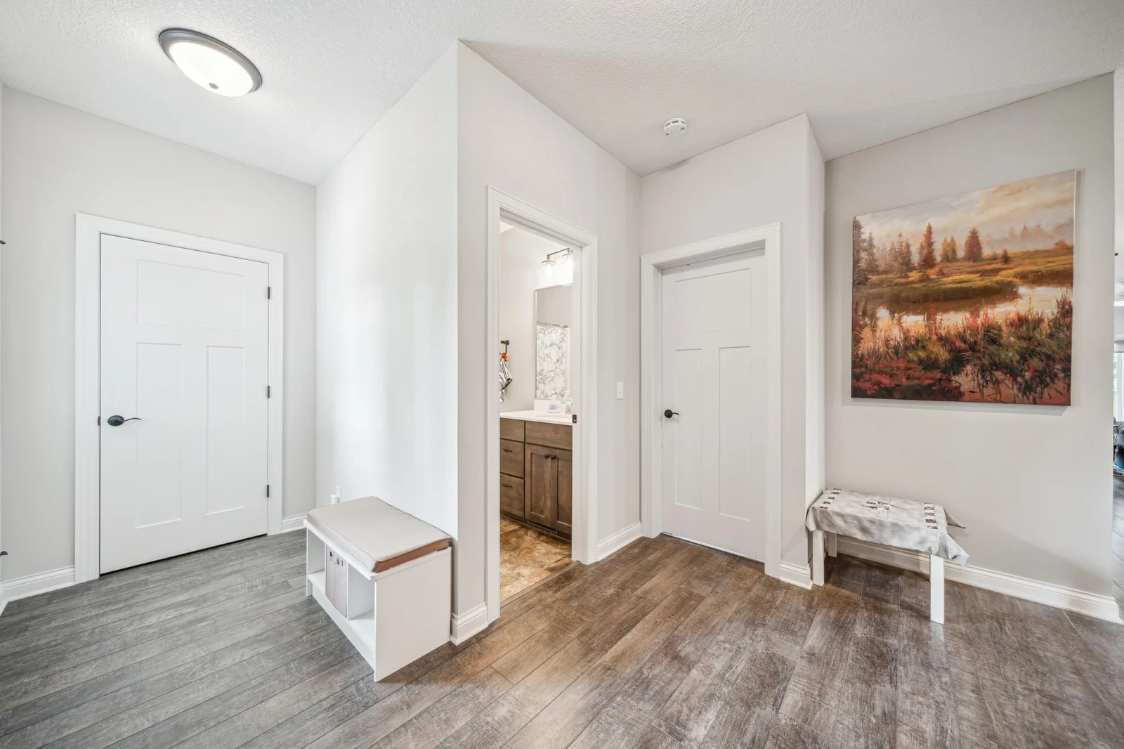 Foyer features coat closet and transition from garage and access to lower level.jpg