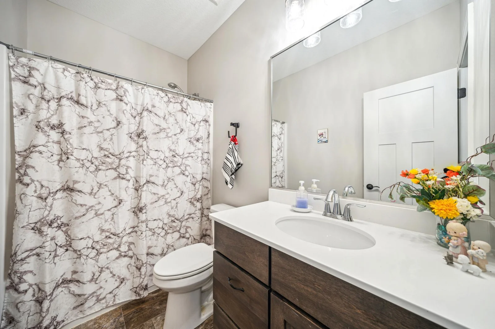 Main level full bath steps from guest bedroom.jpg