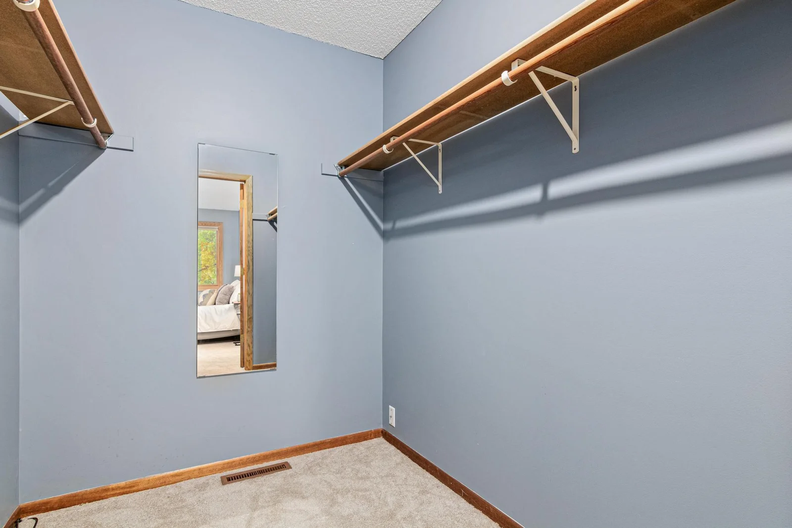 Walk in closet connected to primary bedroom