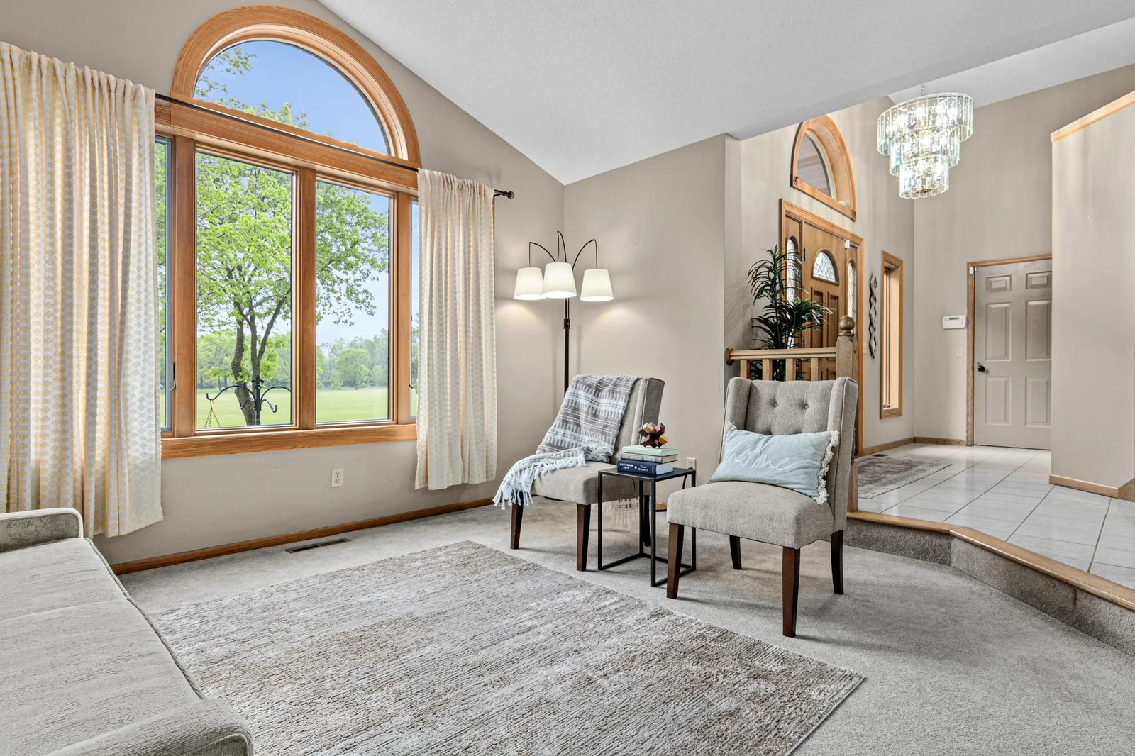 Additional view of the sitting room and entry way