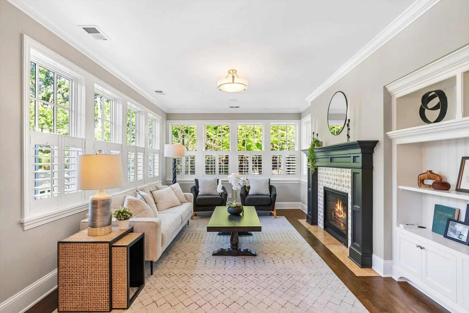 Cozy sunroom with Italian marble fireplace.