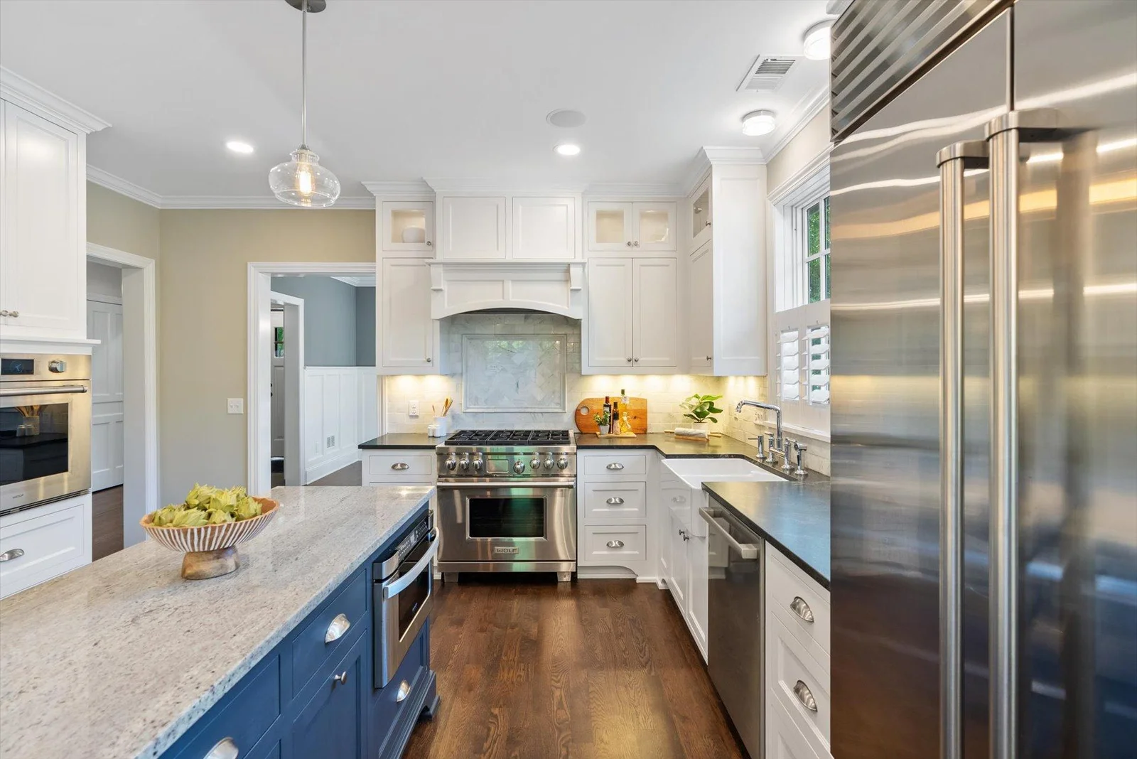 Beautiful kitchen with Wolf stove and wall oven.