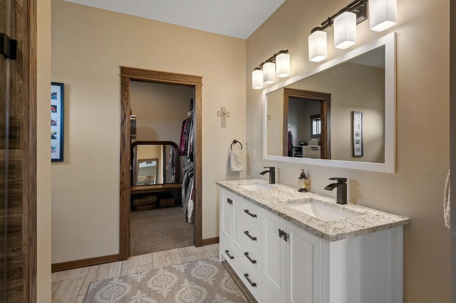 The beautiful finishes continue throughout your primary bathroom! Getting readying in the morning will be a breeze with your dual sinks and abundant counter space.
