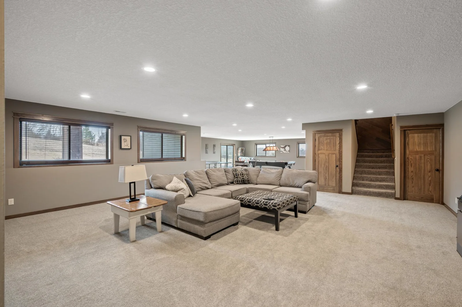 Welcome to your enormous lower level haven for fun and entertainment! A great location for watching a movie together, socializing, or challenging someone to a game.