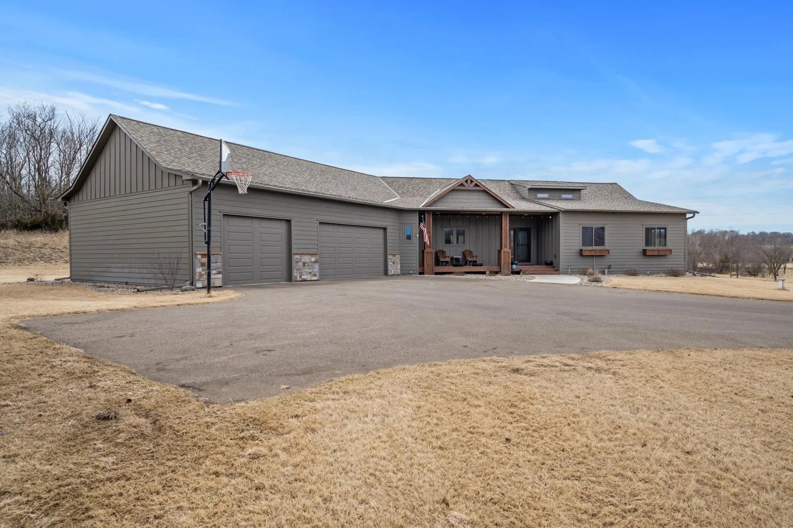 Driving up to the home your eyes will be drawn to the wood columned front porch and stone accents.