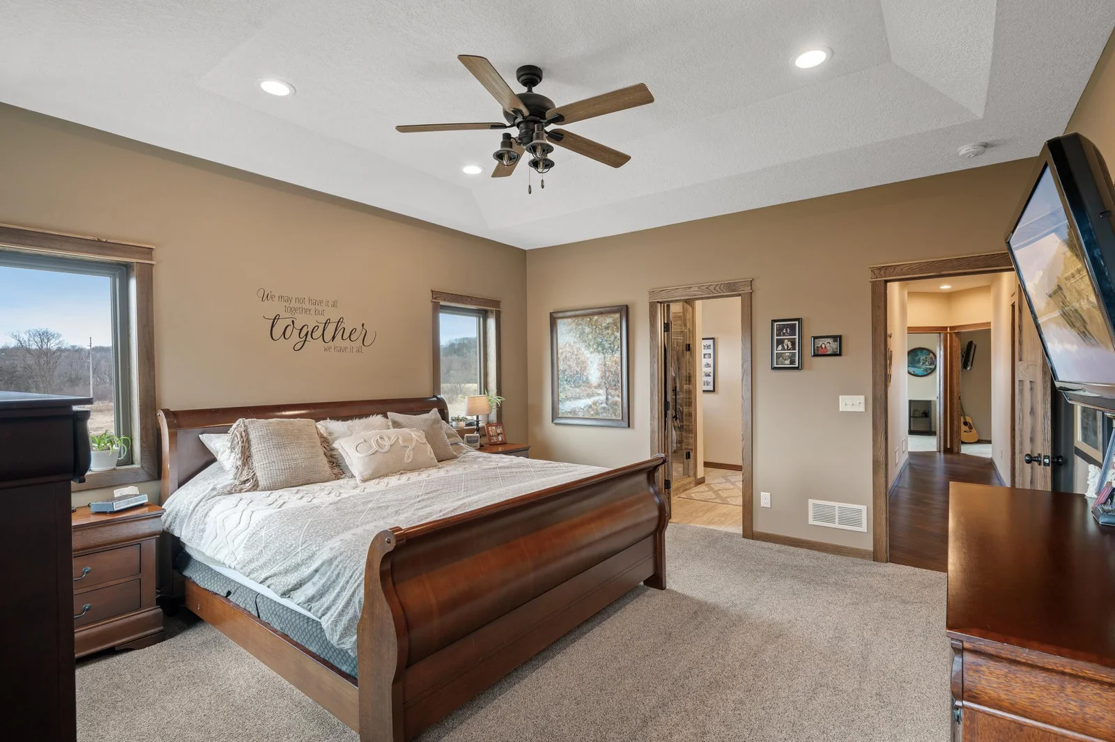 Another view of your spacious primary bedroom showing your ensuite bathroom where the large walk in closet is also located.