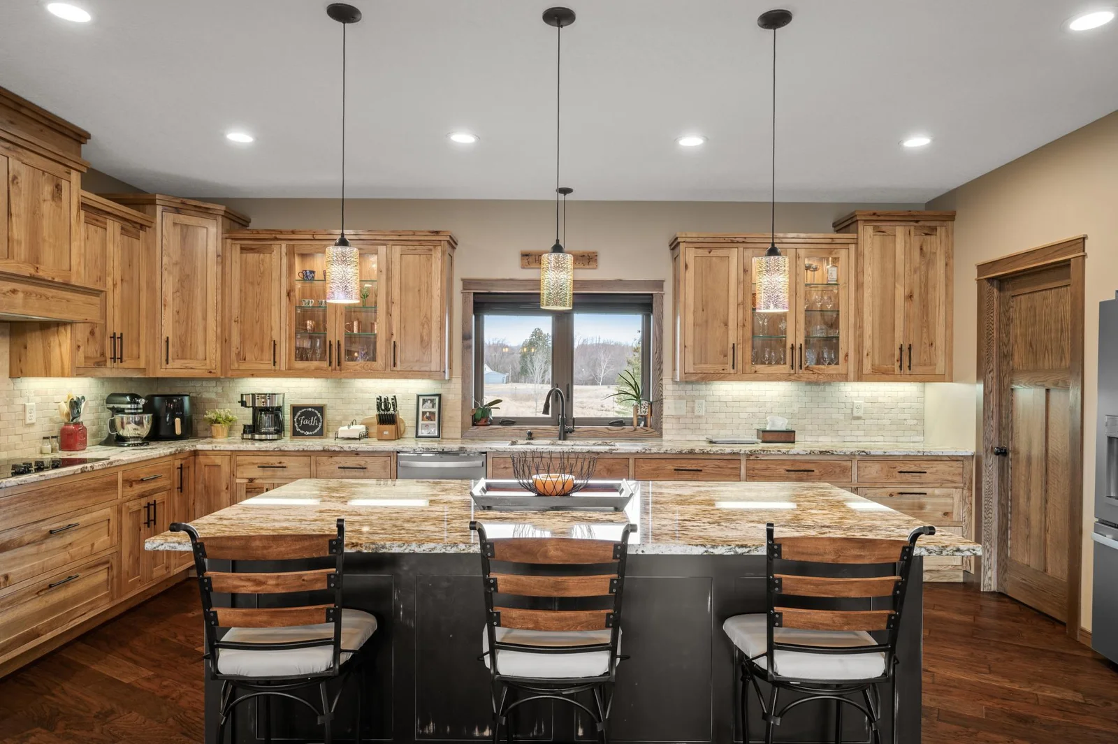 This spacious design offers room for everyone to enjoy time together in the kitchen. There's plenty of space for everyone whether you are cooking a meal or enjoying breakfast at your center island.