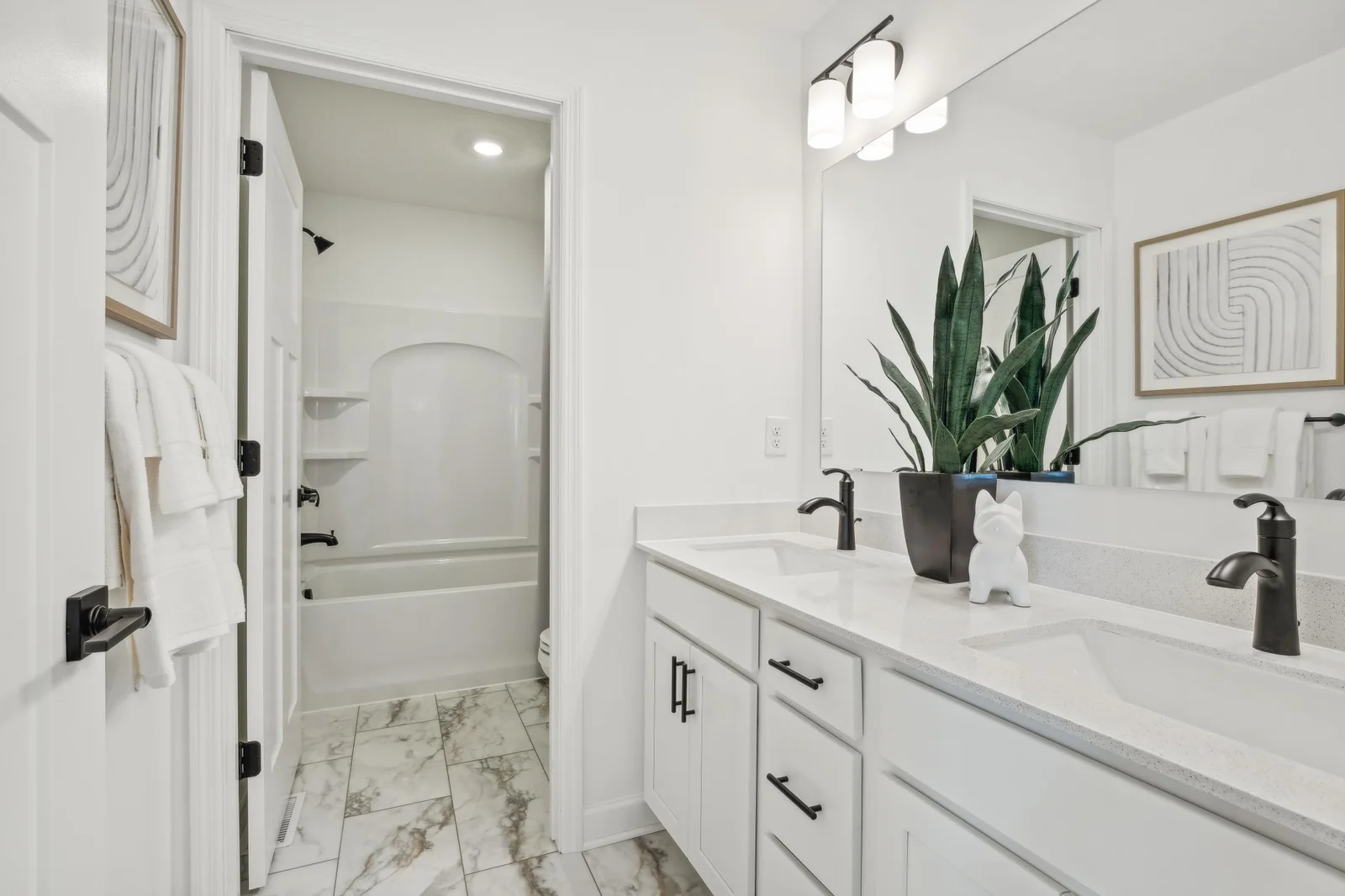Photo is of the actual model. The secondary bath on the upper level provides the perfect amount of space!