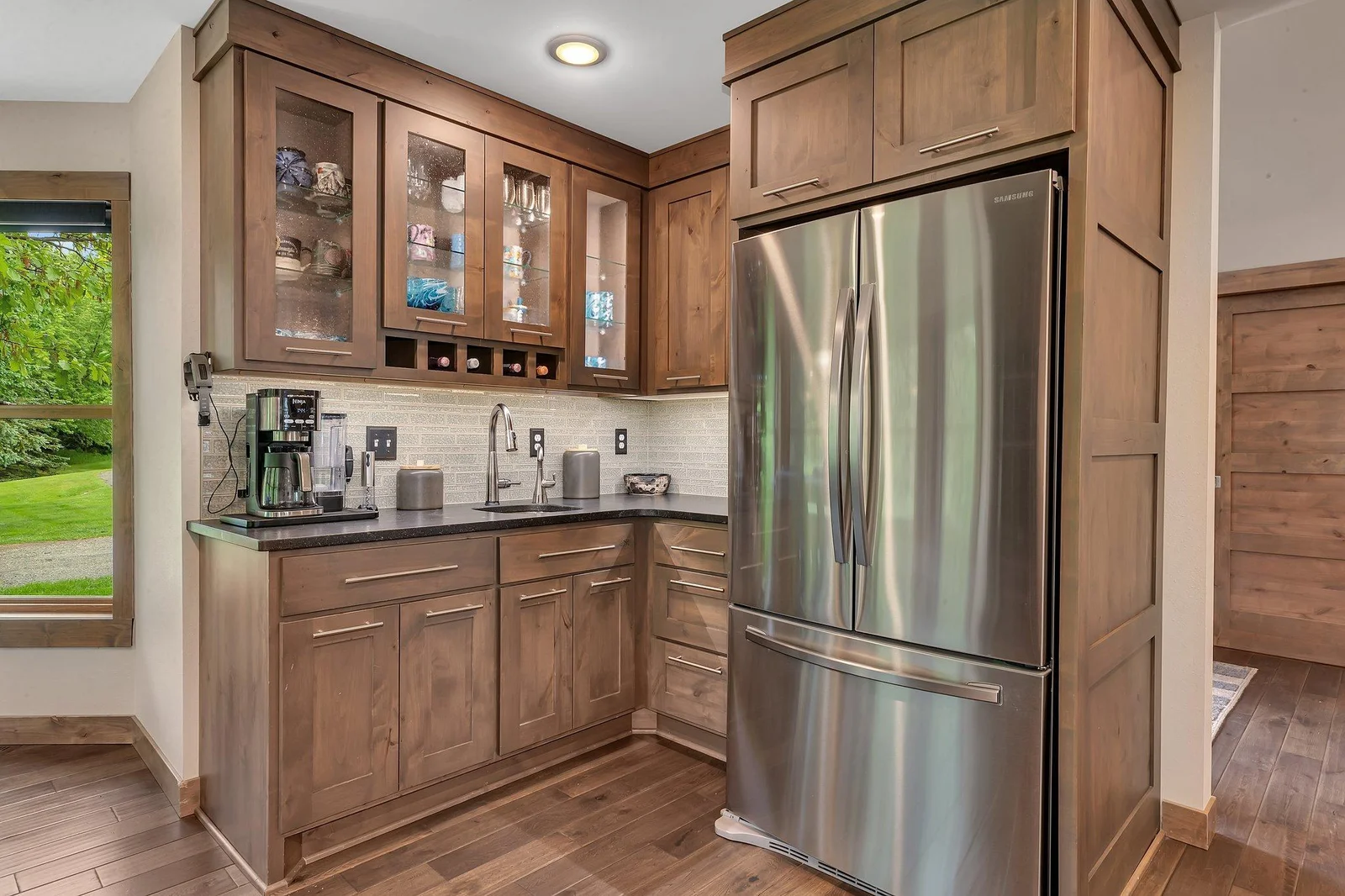 Mornings or Evenings with this convenient coffee bar with integrated wine storage, adding both style and function to the kitchen.