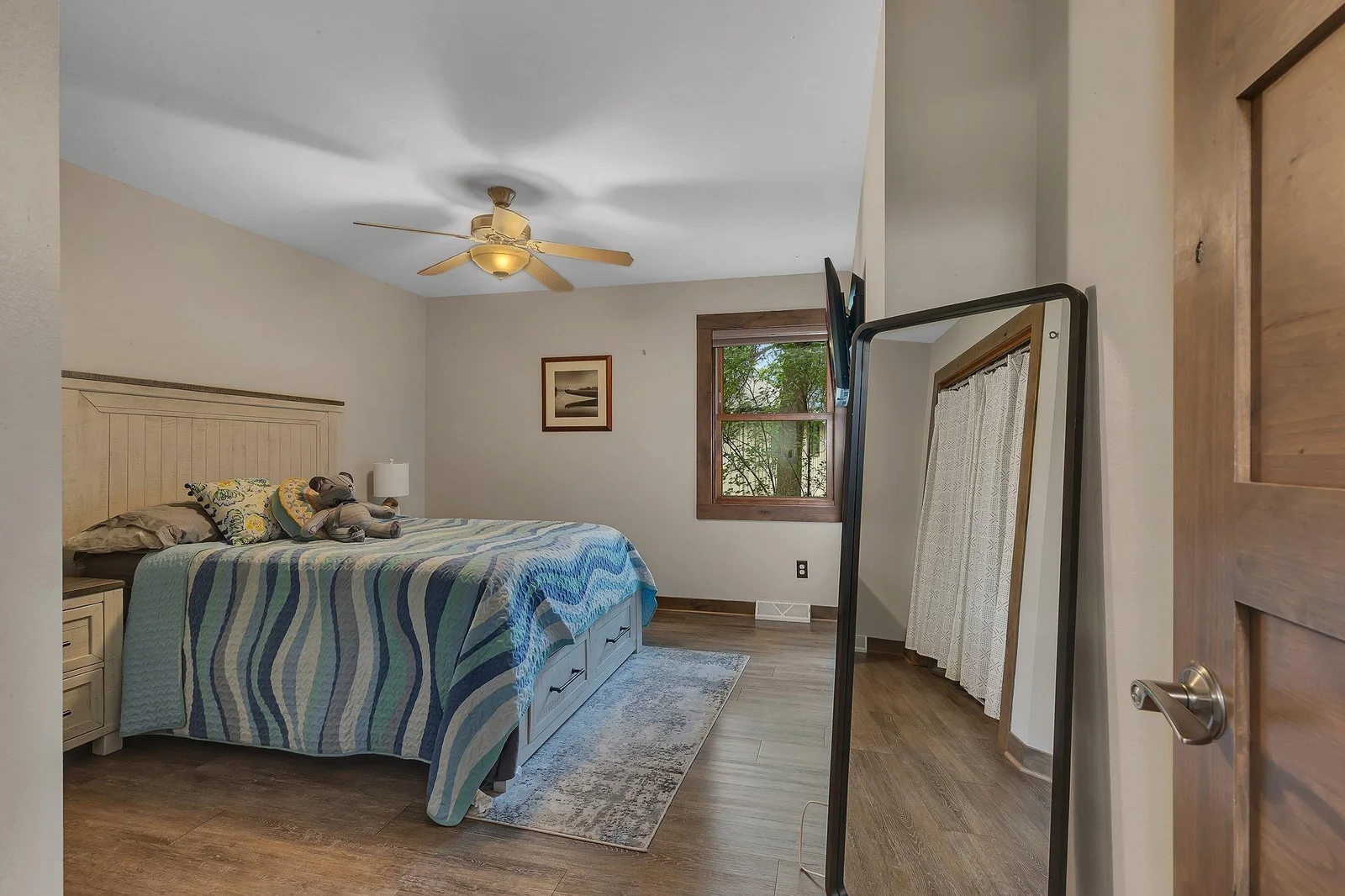 Main level features a second bedroom, perfect for guests or multi-purpose use.