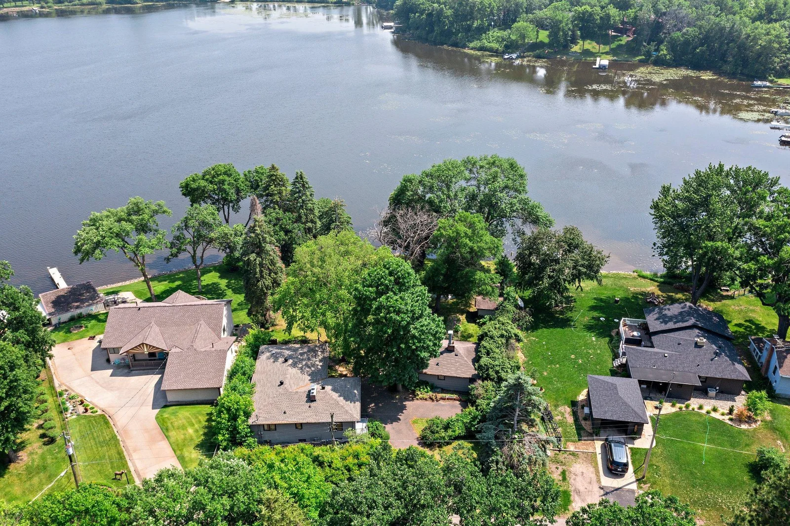 Perfectly situated on the sought-after Briggs Chain of Lakes, this scenic property offers 134 feet of private shoreline on beautiful Rush Lake, providing a tranquil setting for both everyday living and unforgettable getaways.