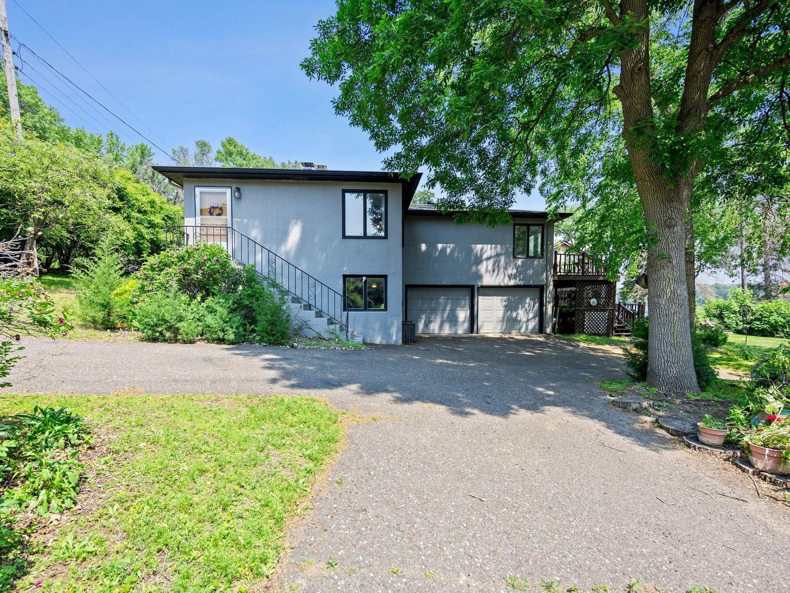 ...a large driveway with extra parking pad for guests or recreational vehicles, and an included dock and negotiable paddle boat.
