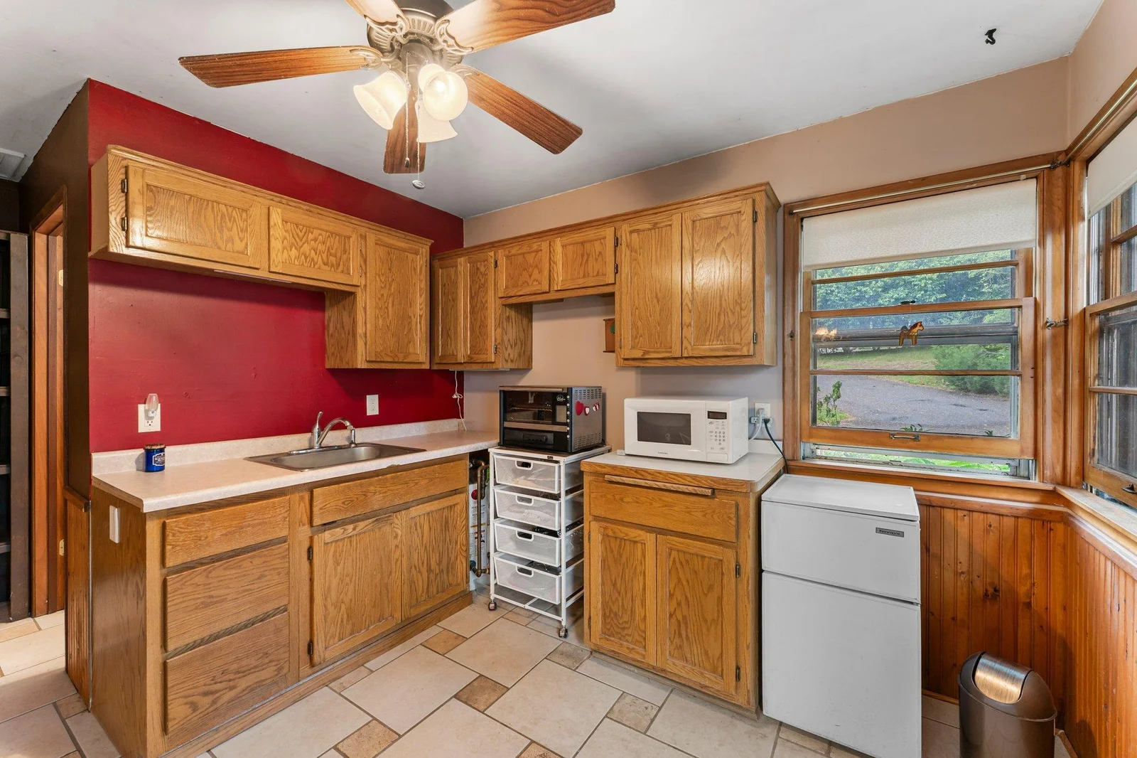 The guest house features a kitchen with ample cabinetry and space for additional appliances.