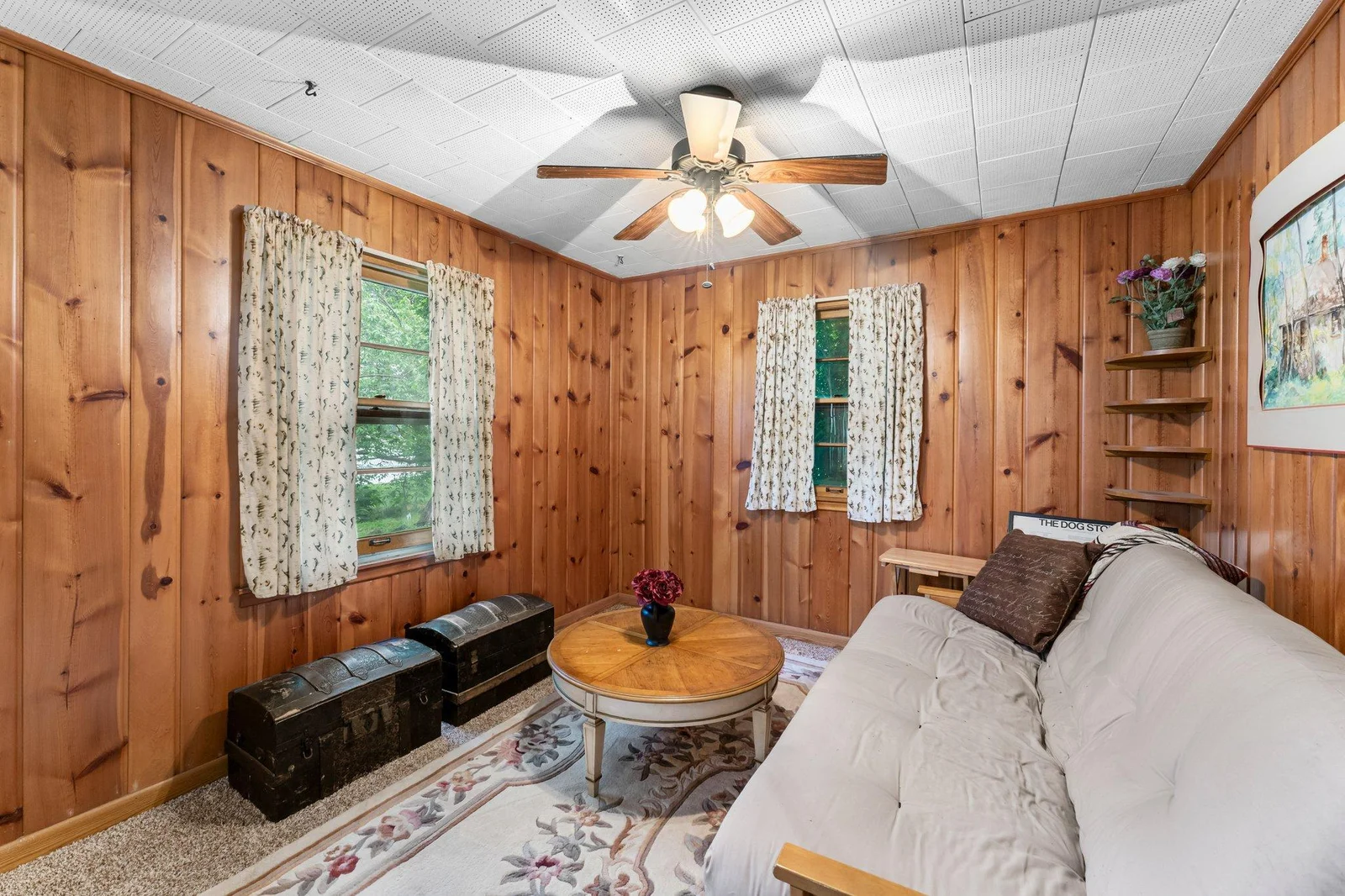The family room includes carpeting and its own wood-burning fireplace for comfort and charm.