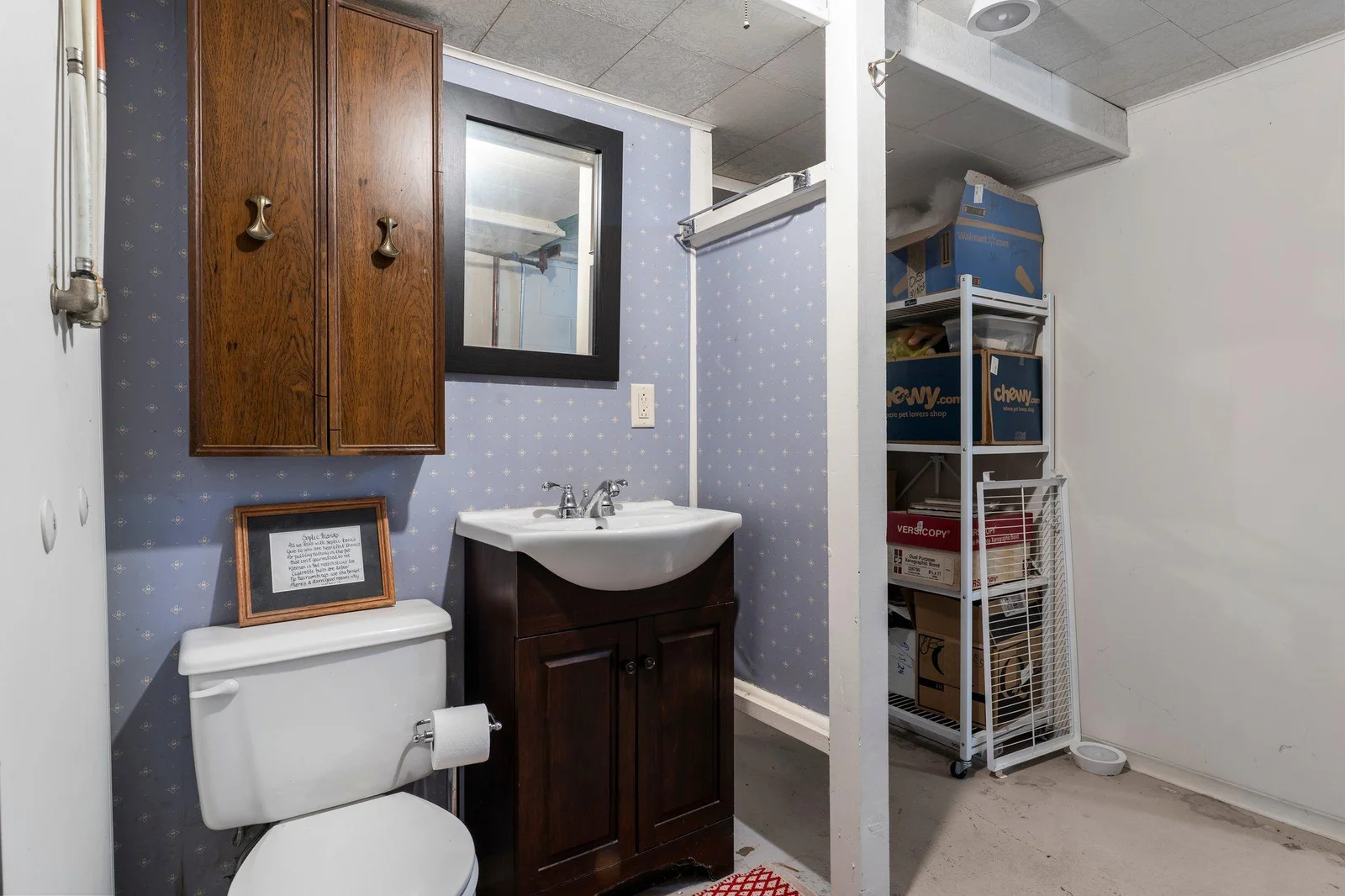 You'll also find a convenient ¾ bathroom and a laundry area equipped with a utility sink and ample storage.