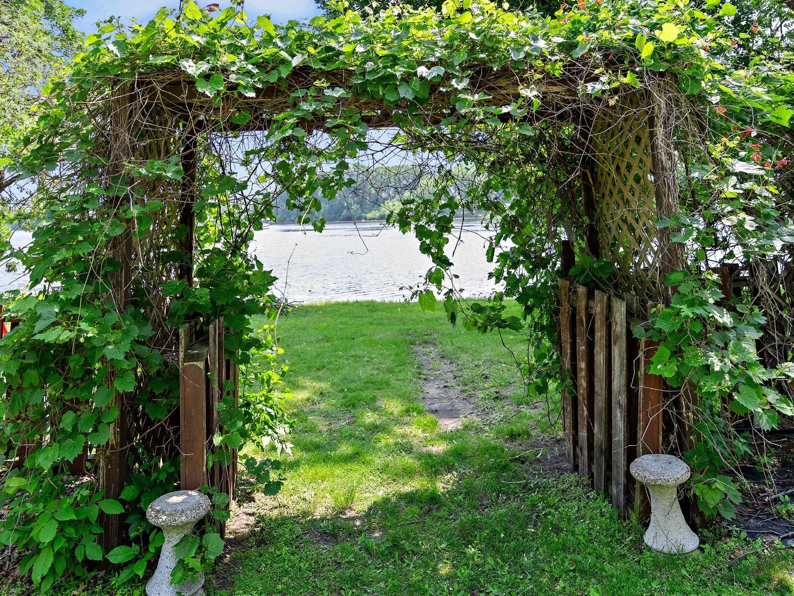 A whimsical archway leads to the shoreline!
