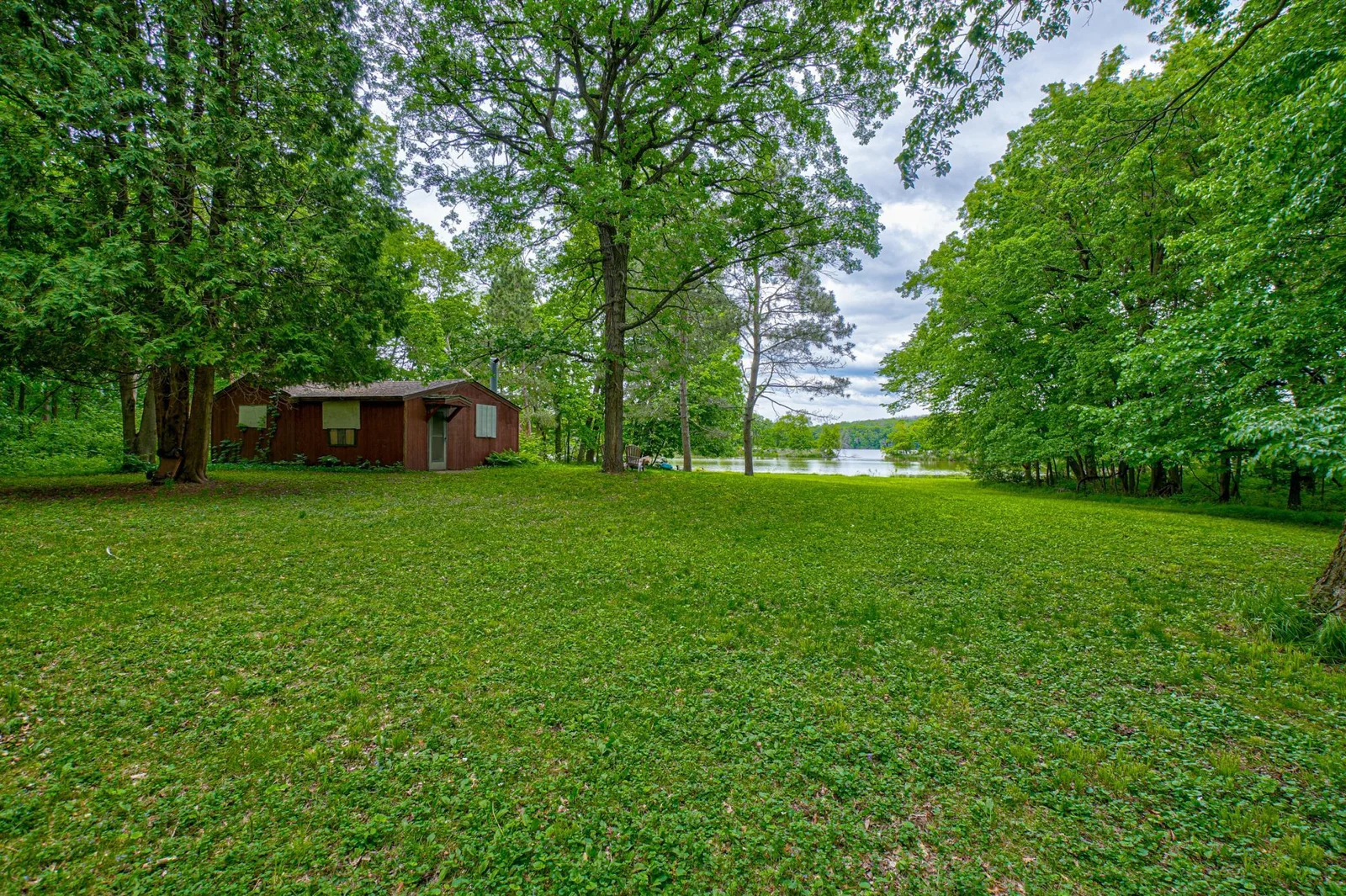 An old cottage awaits your vision—whether you dream of restoring its charm or building anew!