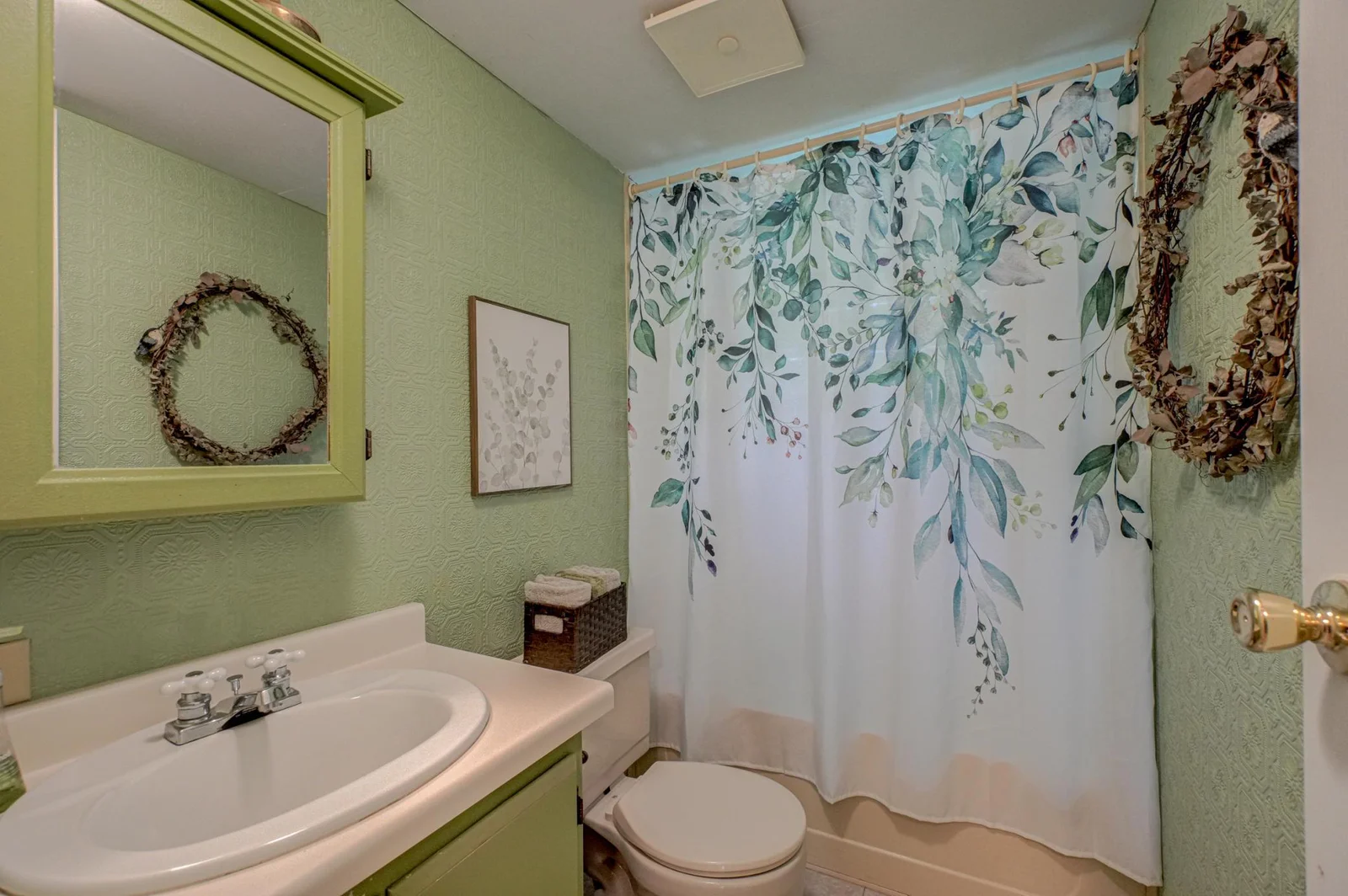 A full bathroom on the main level adds convenience and functionality for family and guests alike