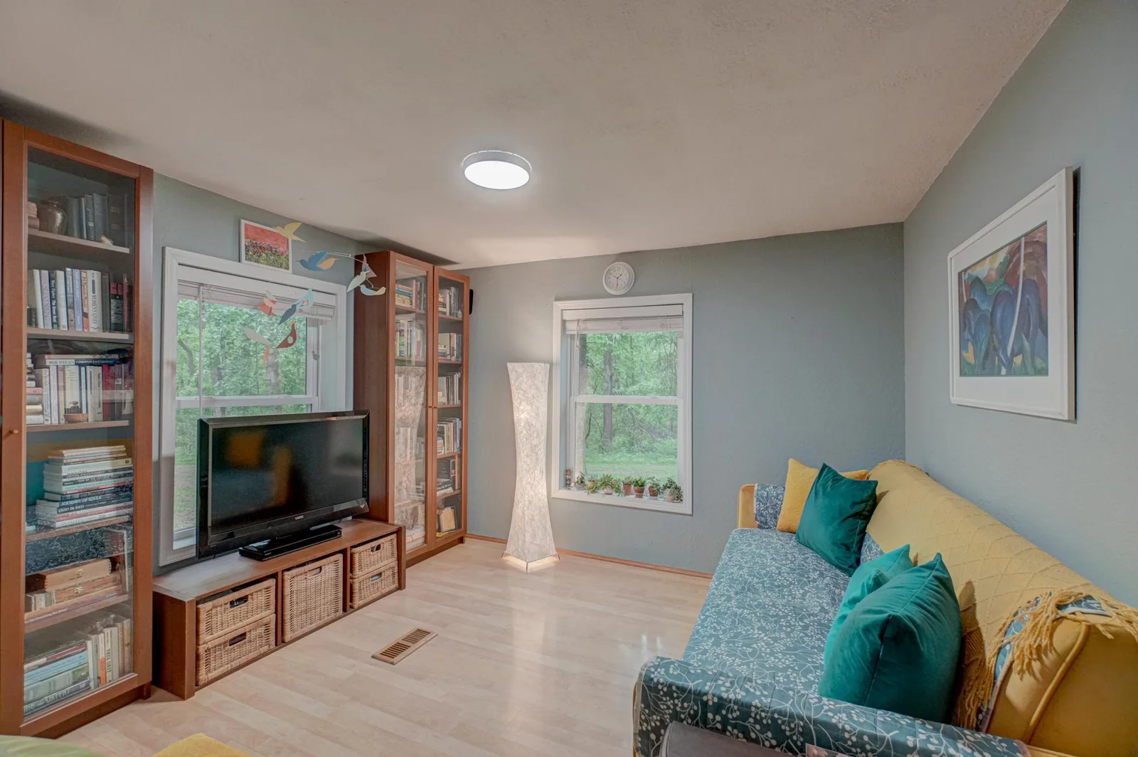 A second main-level bedroom offers flexibility for guests, a home office, or additional living space