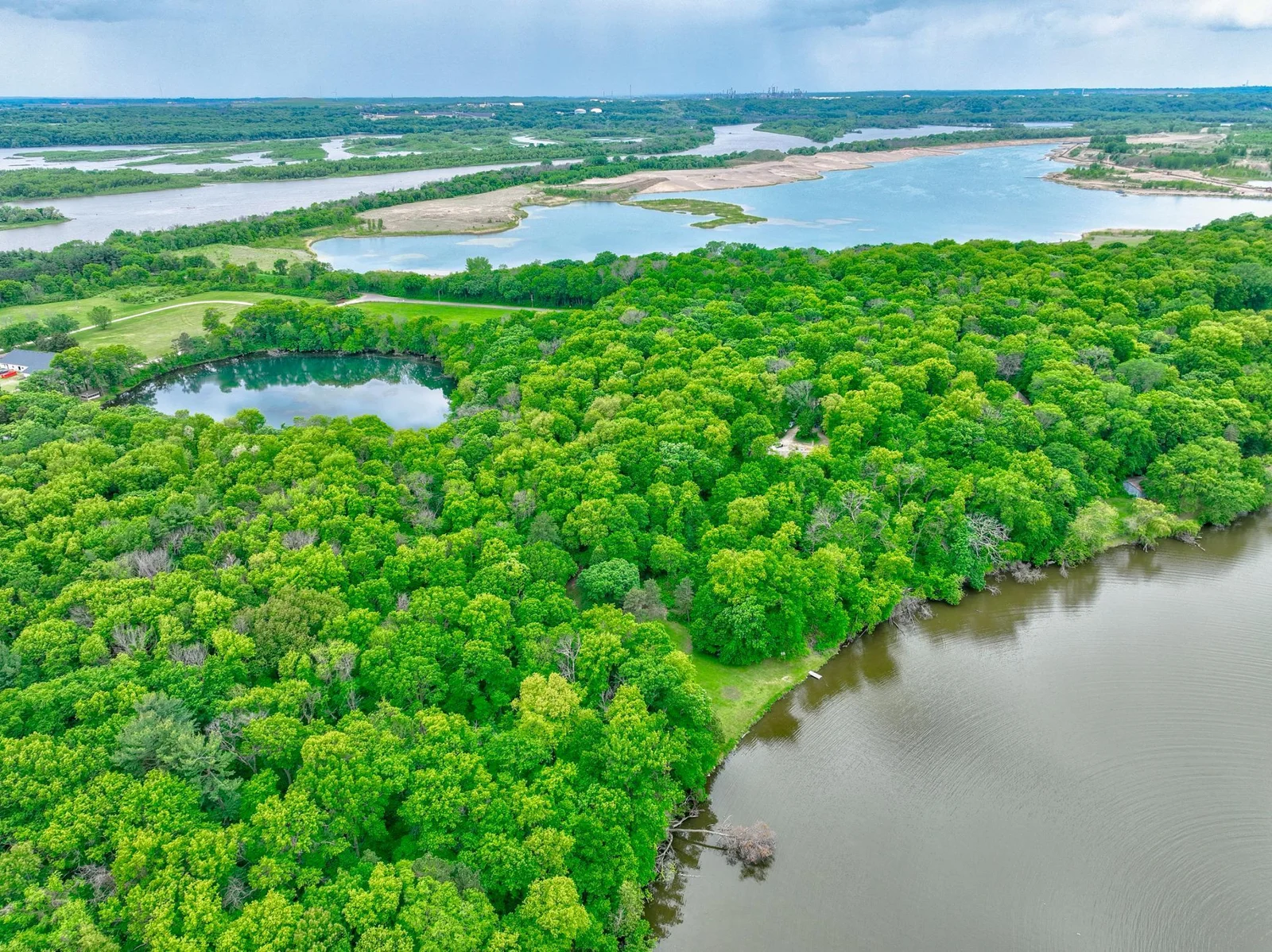 Escape to your own private island sanctuary! 14.25 subdividable acres tucked away in the backwaters of the Mississippi River, on the coveted Lower Grey Cloud Island!