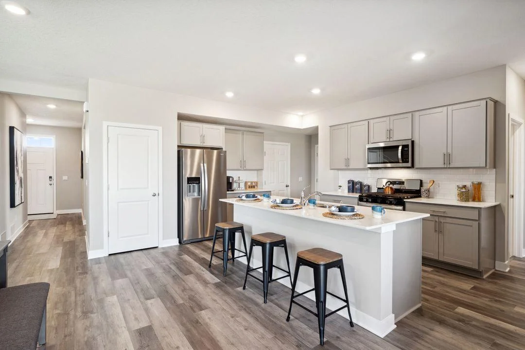 Another view of the kitchen and ample storage.