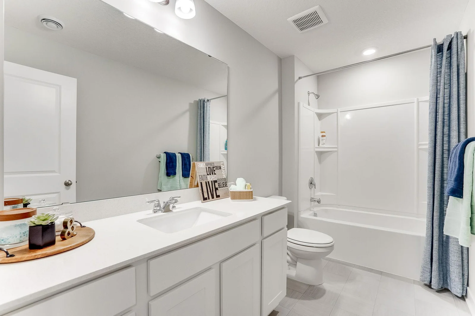 The shared bath on the upper level