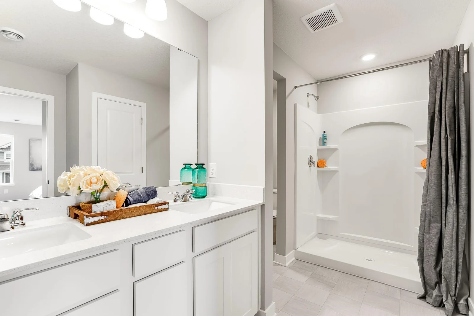 The primary bedroom has double sinks, then take refreshing shower!