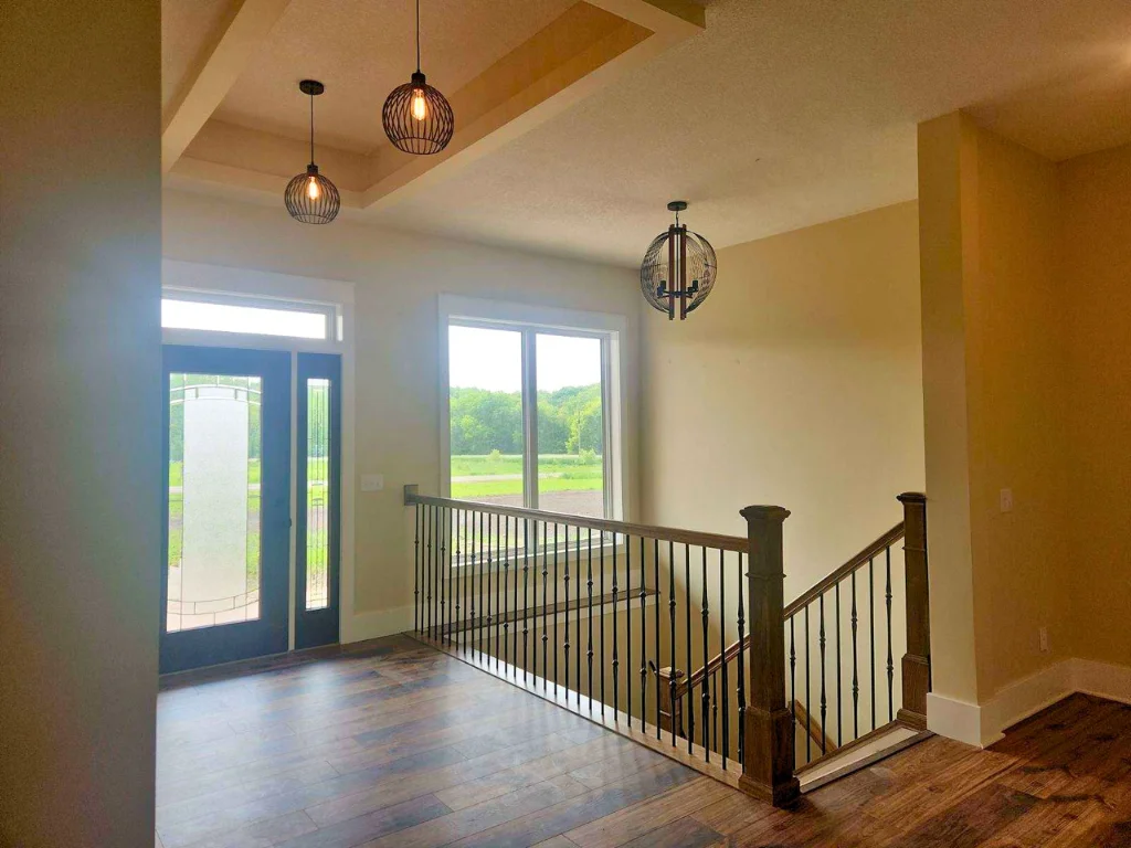 Walking in you are greeted by an impressive 10’ ceiling crowned with an 11’ backlit box vault, setting the tone for the rest of this stunning home.