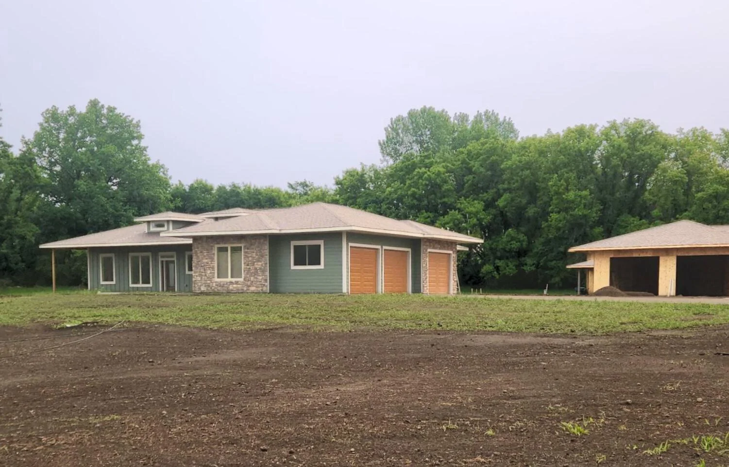 Enjoy all your living facilities on one level and having easy access to walk right outside your front and back door to your porch and patio. You impressive outbuilding is also conveniently just a few steps away!