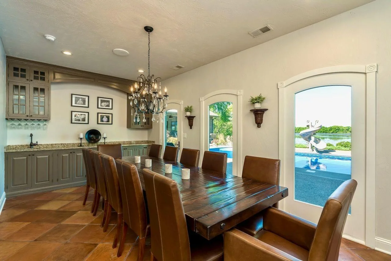 Sit up to 12 people in your grand dining room with wetbar, built in buffet and pool/lake views