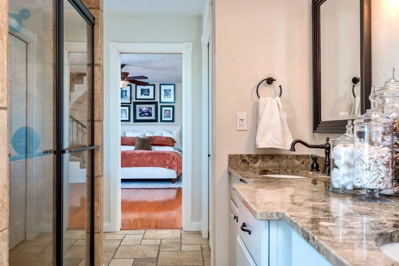 A show stopping primary bath with dual sinks, separate shower and soaking tub