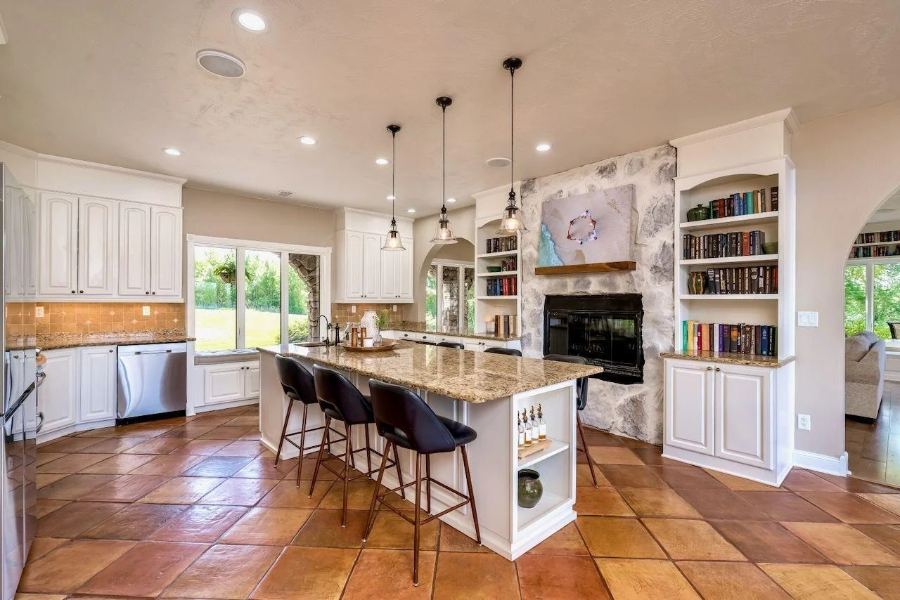 Enjoy preparing meals on this huge island with a cozy two sided fireplace